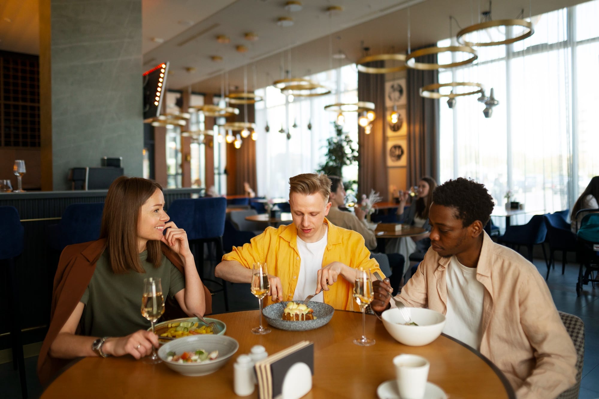 Friends dining together at a restaurant table